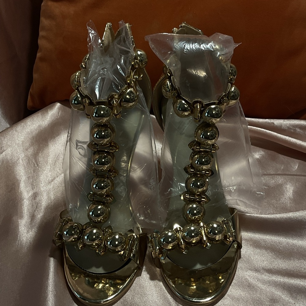 Golden studded heels.